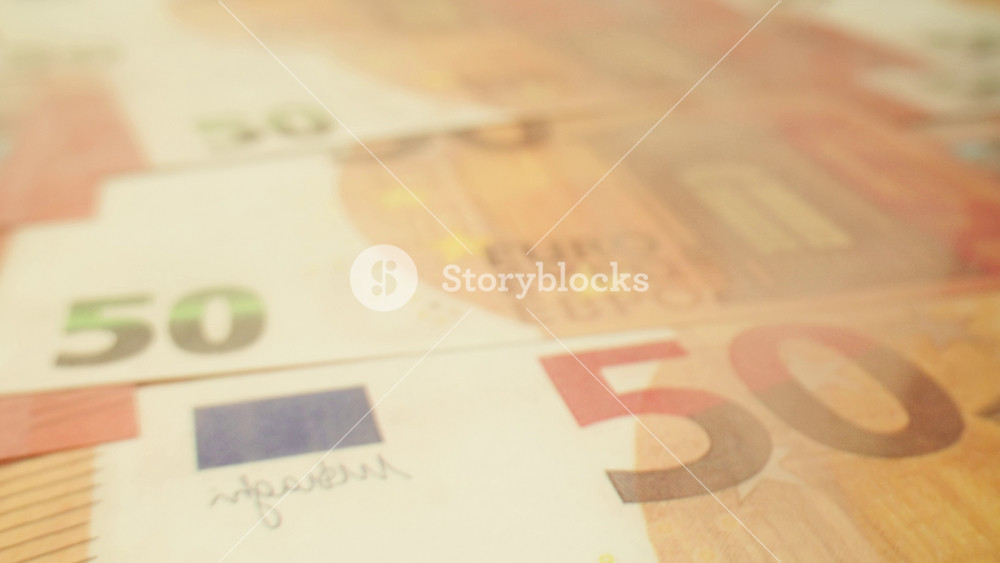 Stacks of cash dollars and euro, Banknotes counting, Specialised police officer Counting dollar euro banknotes in crime lab with machine