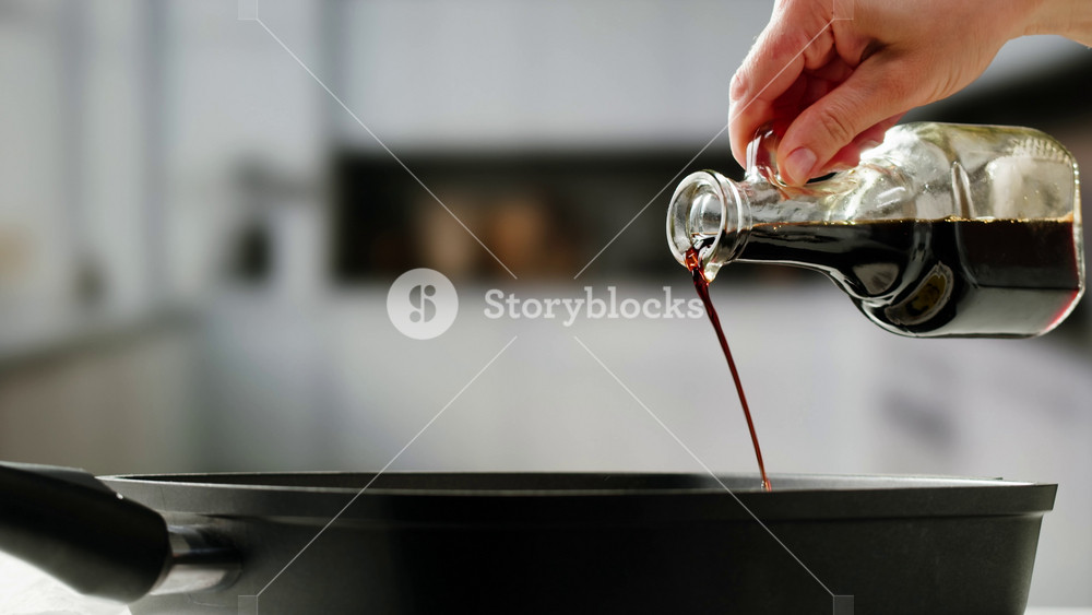Pouring olive linen oil sunflower in different dishes close-up. Using in cooking for frying foods or as a salad dressing omega 3. Olive oil