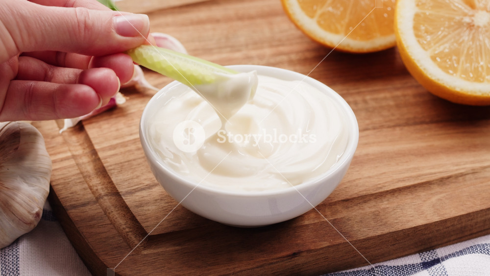 Mayo white sauce with vegetables, carrot healthy vegan food, mayonnaise Curry cheese lemon sauce close up, fast food cafe Pouring fries