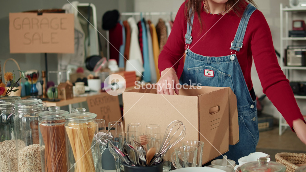 Young Woman Wrapping Used Second Hand Recycled Sustainable Things for Kitchen. Charity Shop and Garage Sale, Recycling Eco New Life