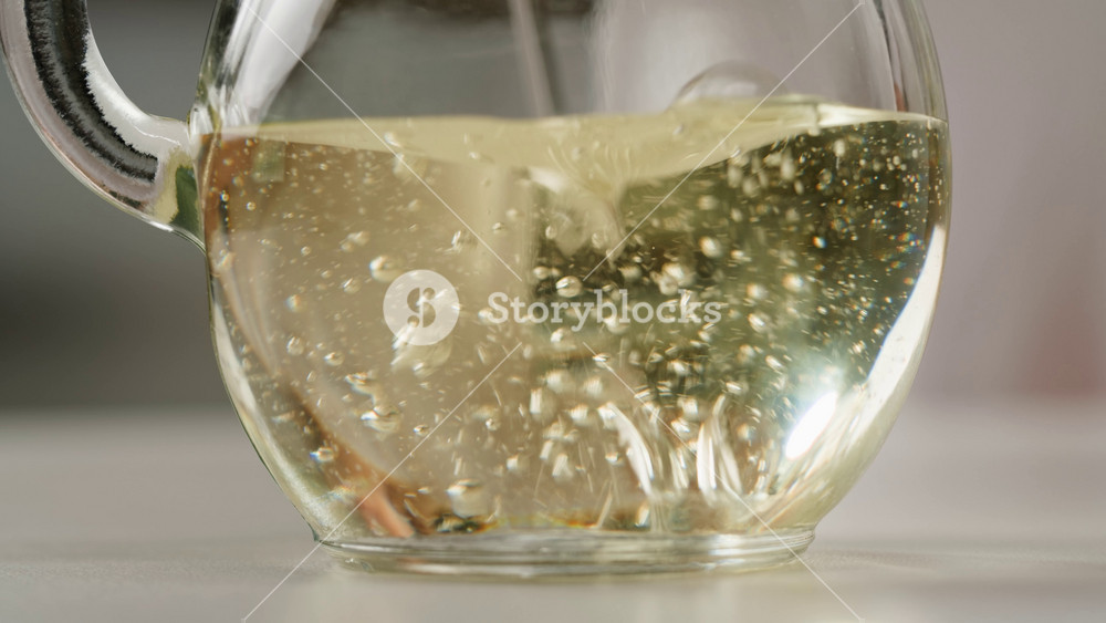 Pouring olive linen oil sunflower in different dishes close-up. Using in cooking for frying foods or as a salad dressing omega 3. Olive oil