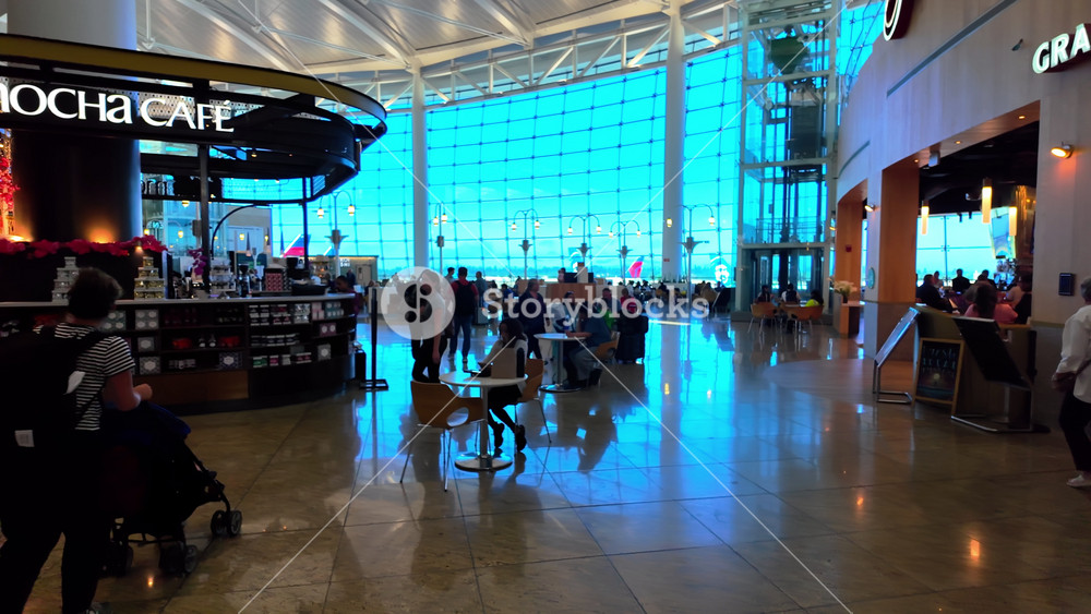 POV of passenger area at the Seattle Tacoma International Airport, Departure Lobby. Airport dinning waiting Area. Passengers waiting for