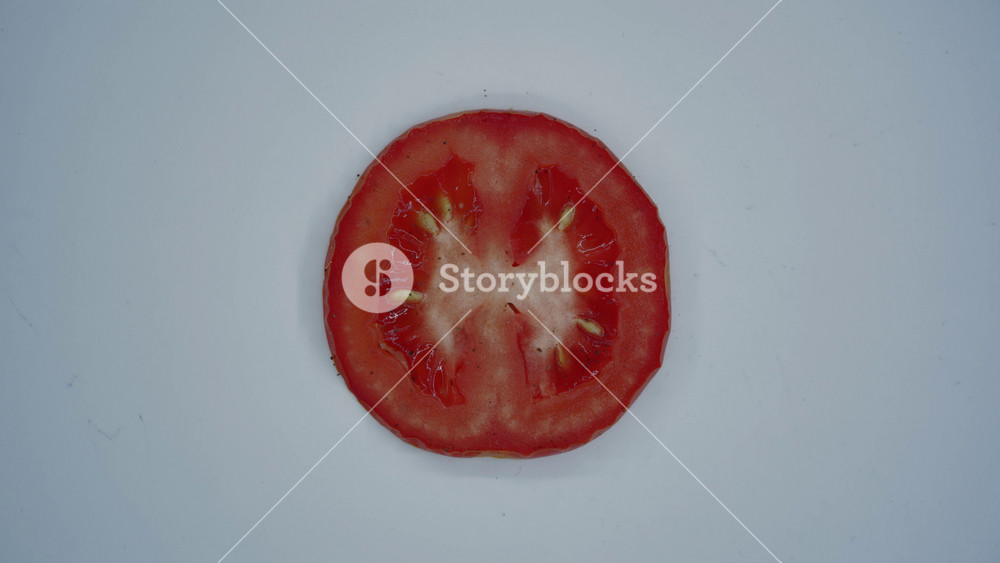 8K timelapse shows tomato slice rotting with mold growth, food spoilage and decay. Fast lapse reveals fungus spreading on expired produce, signaling waste, contamination, unhealthy risk.