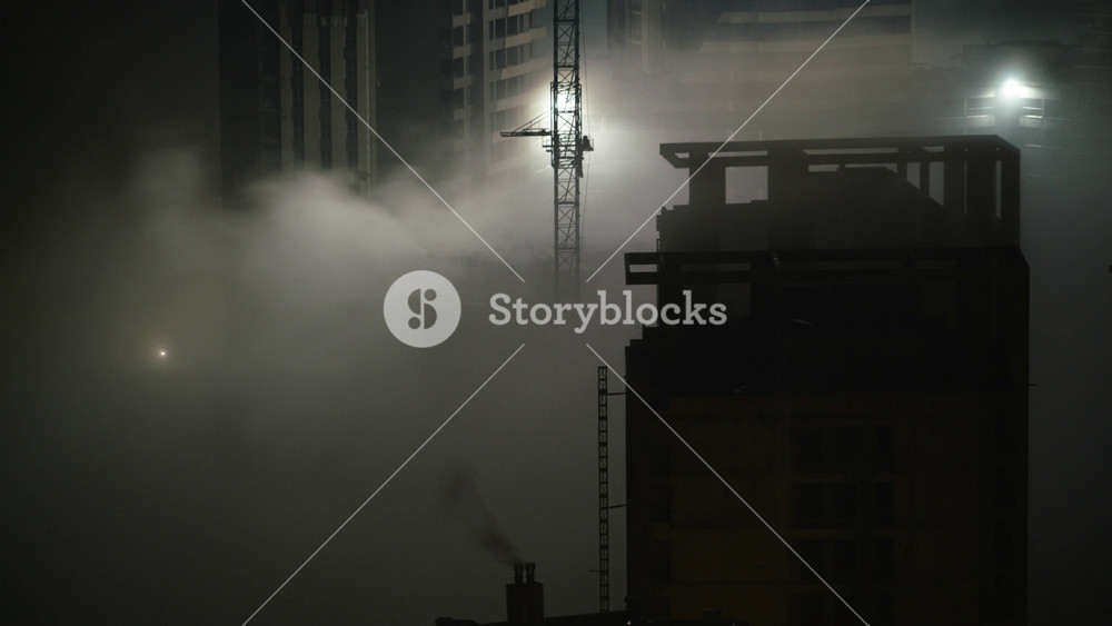 Cinematic 8K night construction site shrouded in smoke, harsh lights, concrete towers, tension. Nocturnal industrial yard under murky haze, iron skeletons and stacks breathe fumes, dread scene.