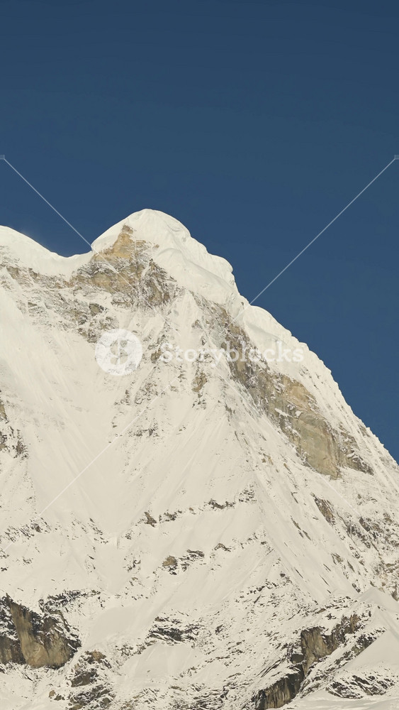 Vertical Snowy Mountain Top Close Up and Clear Blue Sky, Vertical Nature Landscape Video for Social Media Instagram Reels and Tiktok of