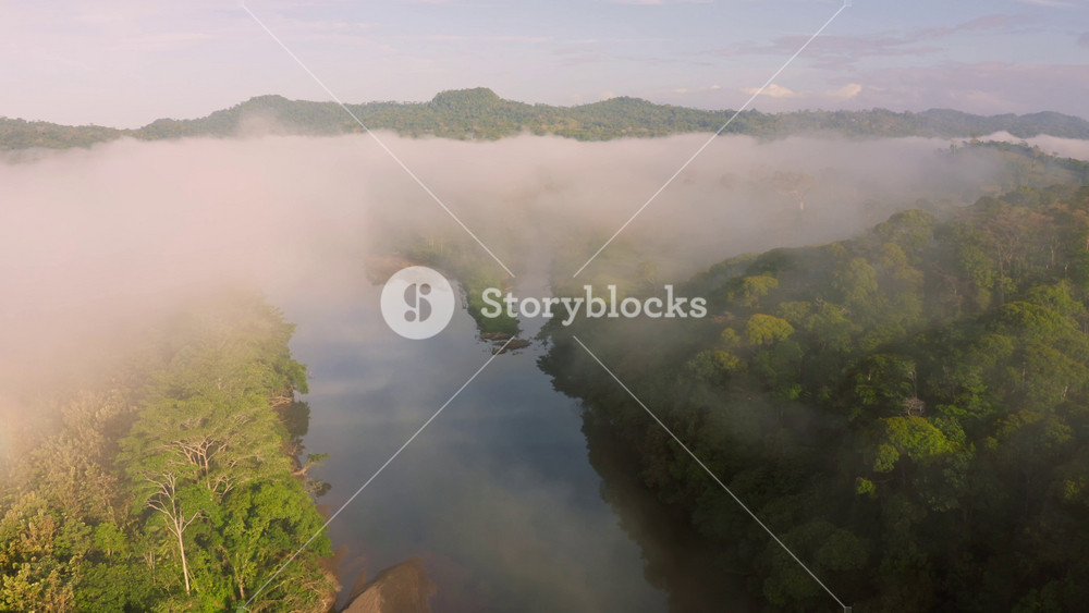 Aerial Drone View of Costa Rica Rainforest Landscape with River and Mountains, Amazing Nature and Misty Tropical Jungle Scenery Above the