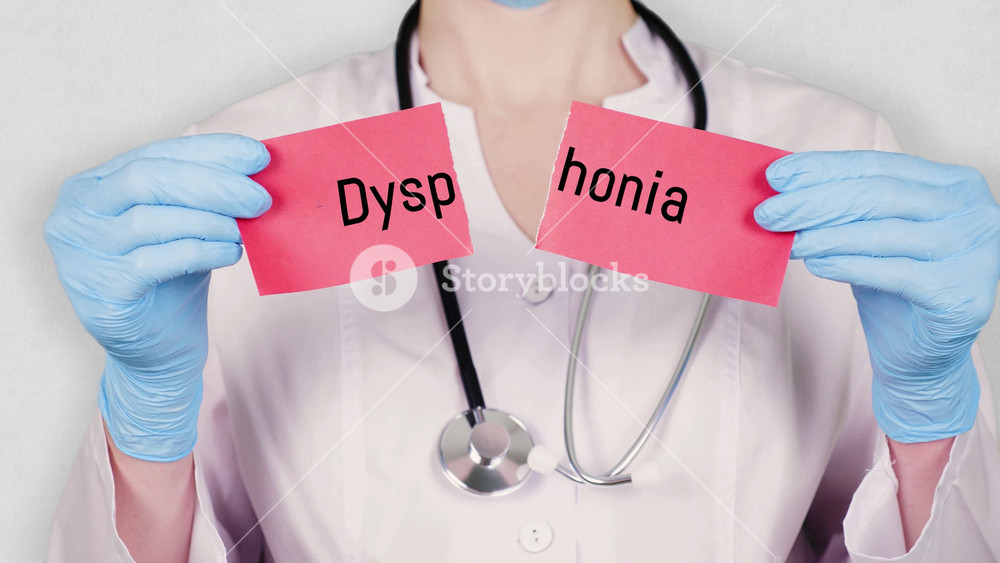 closeup, hands in blue medical gloves hold and tear red paper card with an inscription Dysphonia. doctor dressed in white medical uniform, has a stethoscope.