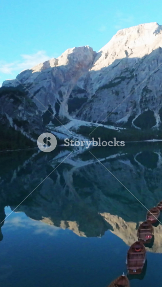 Vertical Screen, Lago Di Braies, Italy Aerial Scene Mountain Reflection Mirrored In Glassy Lake At Lago Di Braies, Italy, With Chain Of
