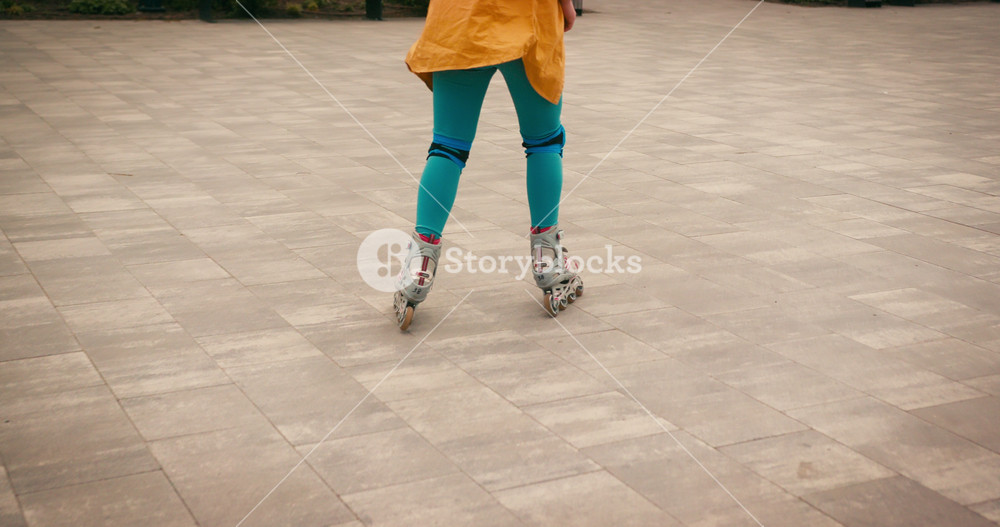 Teenager Roller Skater Girl with Blue Hair Riding Practicing Stunt Trick at Skate Park. Training Hobby Active Lifestyle Youth Culture
