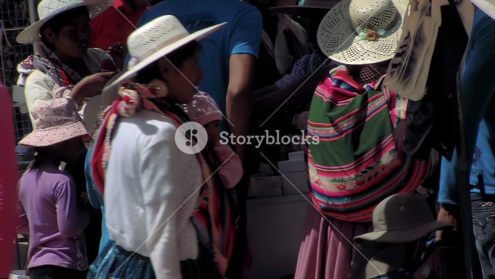 Quillacollo, Bolivia - August 16, 2015: Indigenous Mother Carrying Baby During Virgen de Urkupina Festival, Quillacollo, Bolivia - 4K