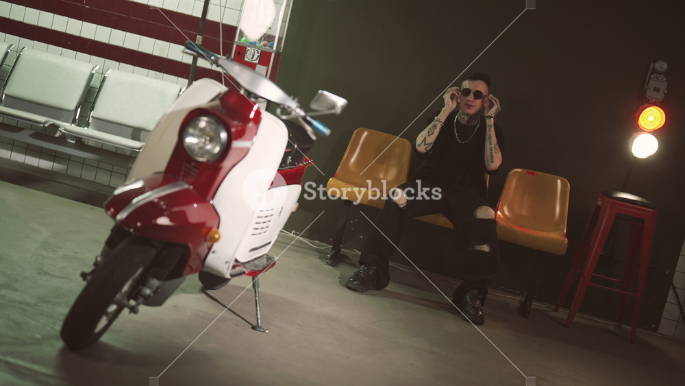 Hip-hop singer filming music video in metro station, contemporary music style. Cool young man performing new song, popular rap artist, retro