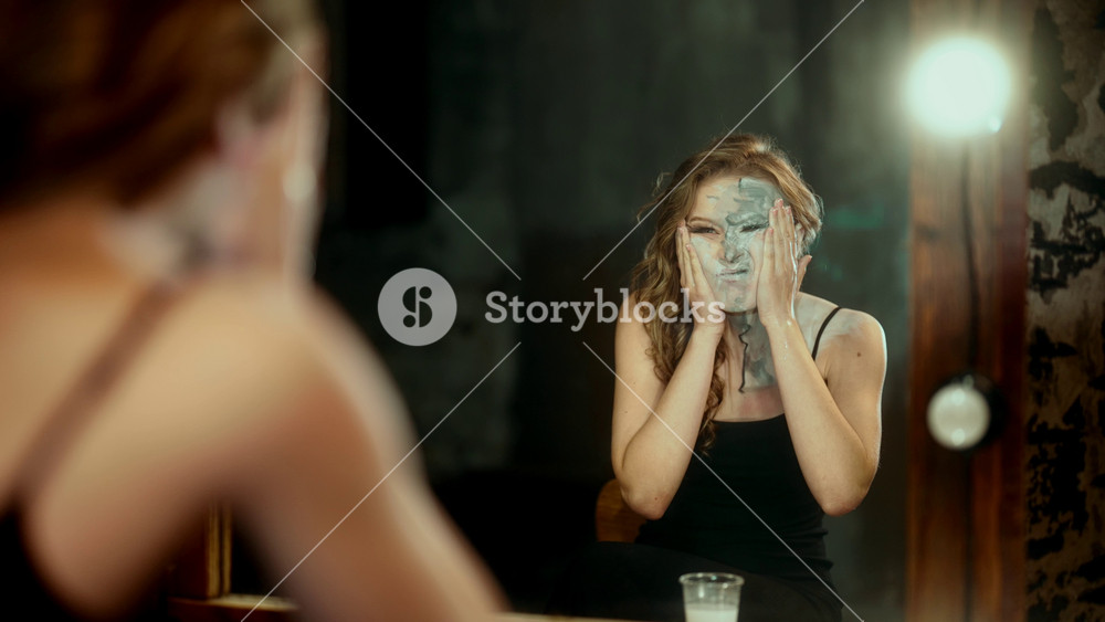 Exhausted actress removing stage makeup, play role for other people, pretending. Female beauty and cosmetics, skincare for save healthy of