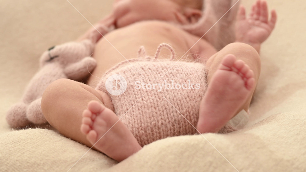 Sleeping newborn cute baby girl or boy during first week of life. 4k slow motion120 fps raw video. Happy family concept. Small baby sleep in