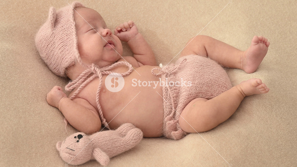 Sleeping newborn cute baby girl or boy during first week of life. 4k slow motion120 fps raw video. Happy family concept. Small baby sleep in