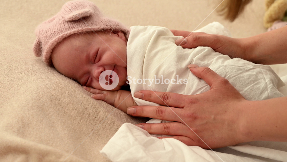 Sleeping newborn cute baby girl or boy during first week of life. 4k slow motion120 fps raw video. Happy family concept. Small baby sleep in