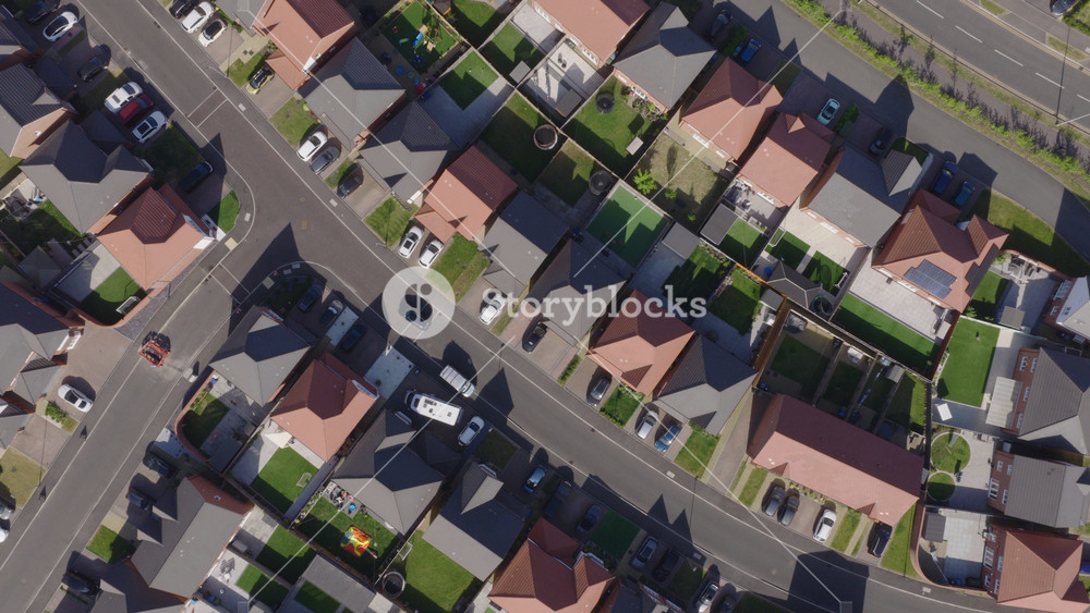 Top down aerial view of new build suburban houses in the United Kingdom. Housing market and suburban lifestyle concept.