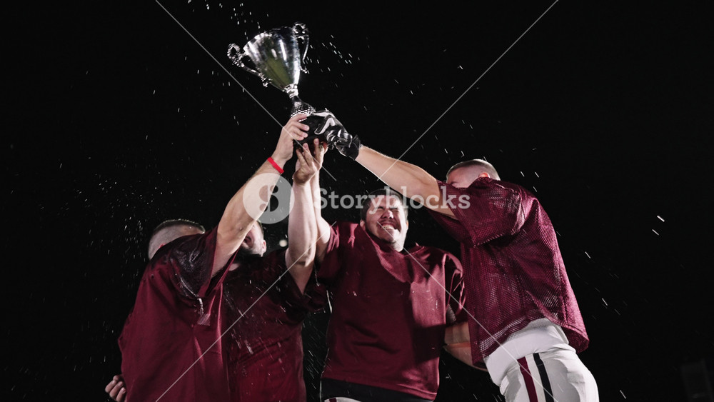 American Football Team in White Uniform in the Middle of the Field, Celebrating a Triumph Championship Victory Winning Game