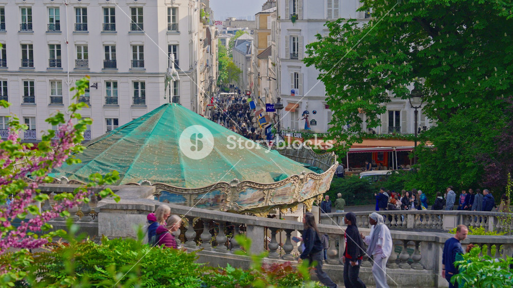 France, Paris, 24. 06. 2025: The most popular historical district of Paris Montmartre with its color, entertainment and many tourists from all