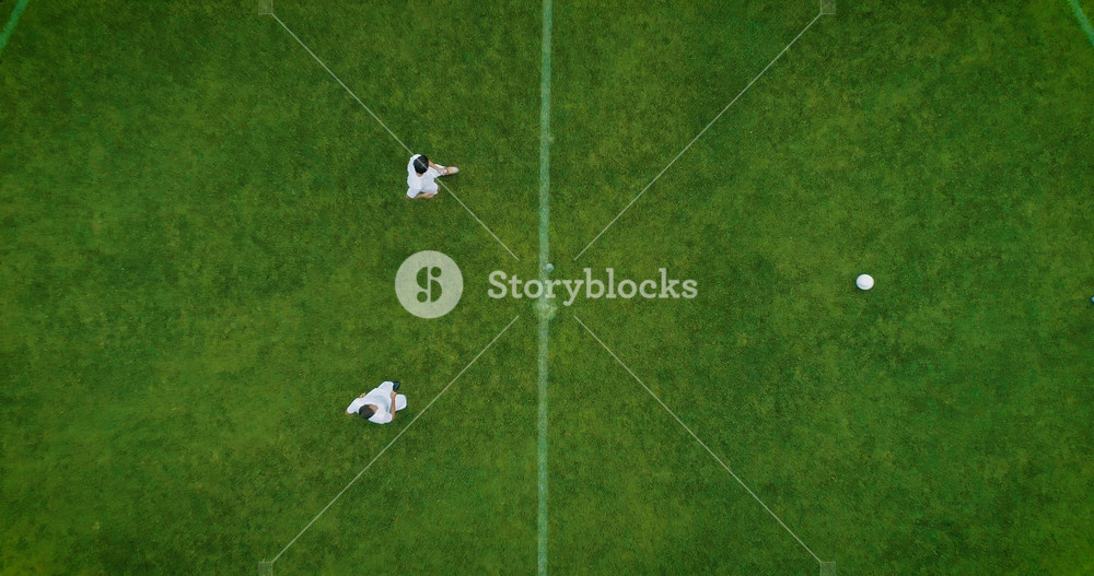 Aerial Top Down View of Soccer Field and Two Professional Teams Playing. Kick off Start of the Match on International Championship