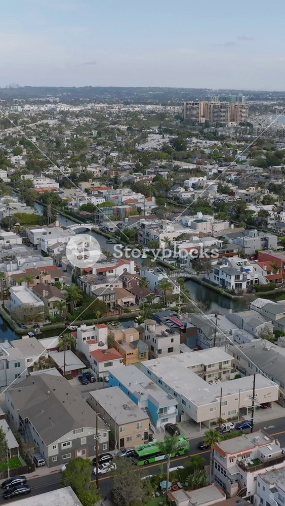 Aerial panoramic footage of Venice borough with famous historic water canals. Residential urban neighbourhood in metropolis. Los Angeles