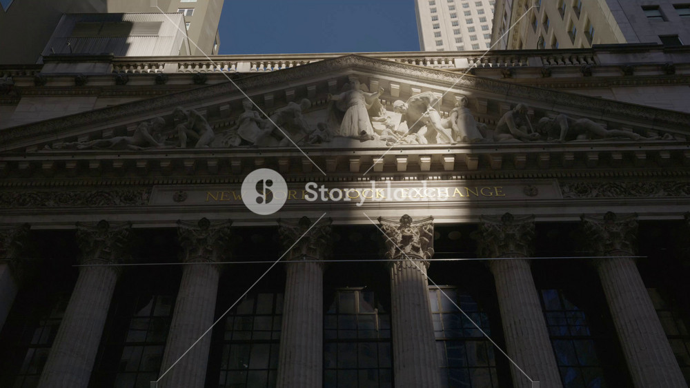 New York Stock Exchange facade and portico with famous pediment and Corinthian columns, Integrity Protecting the Works of Man sculpture on