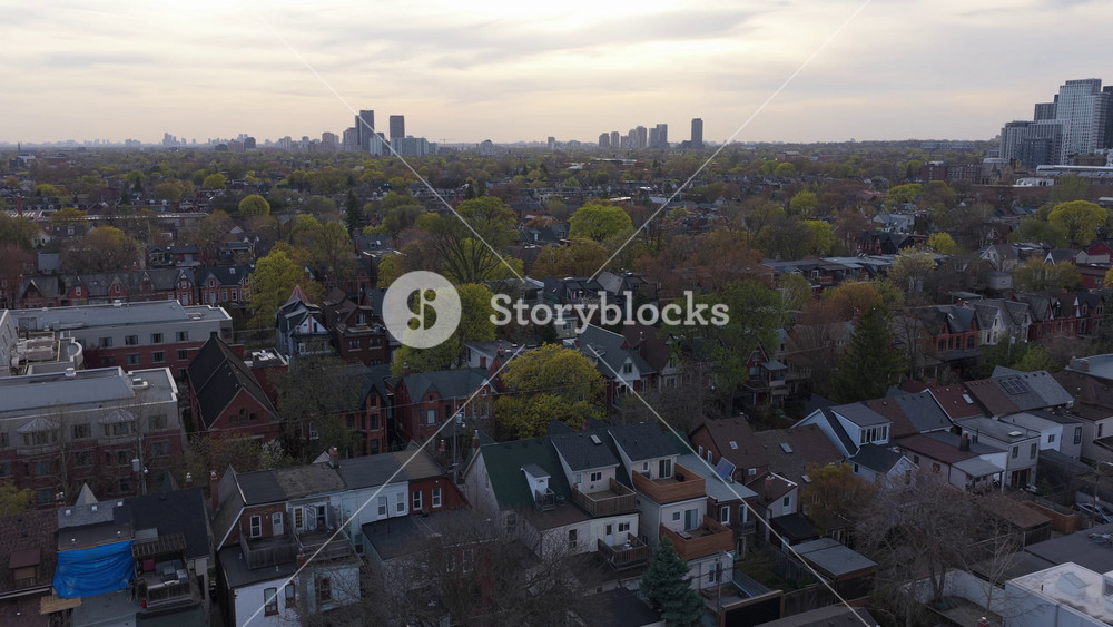 Bird's eye showing North American city urban landscape, residential district, real estate, highlighting homes, trees, and skyline during