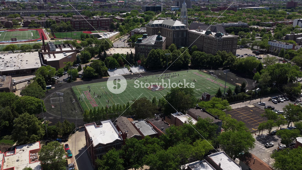 Fornelli Field at Saint Ignatius College Prep in Chicago, lacrosse, soccer, and football training ground, flying over urban landscape of on