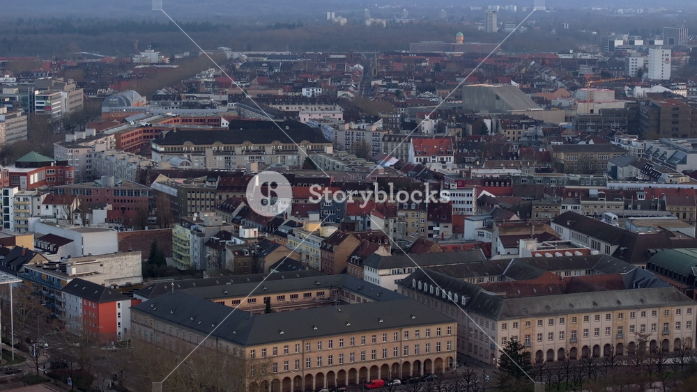 Aerial footage of the BBBank Wildpark football stadium surrounded by Hardtwald forest in Karlsruhe, Germany during fall