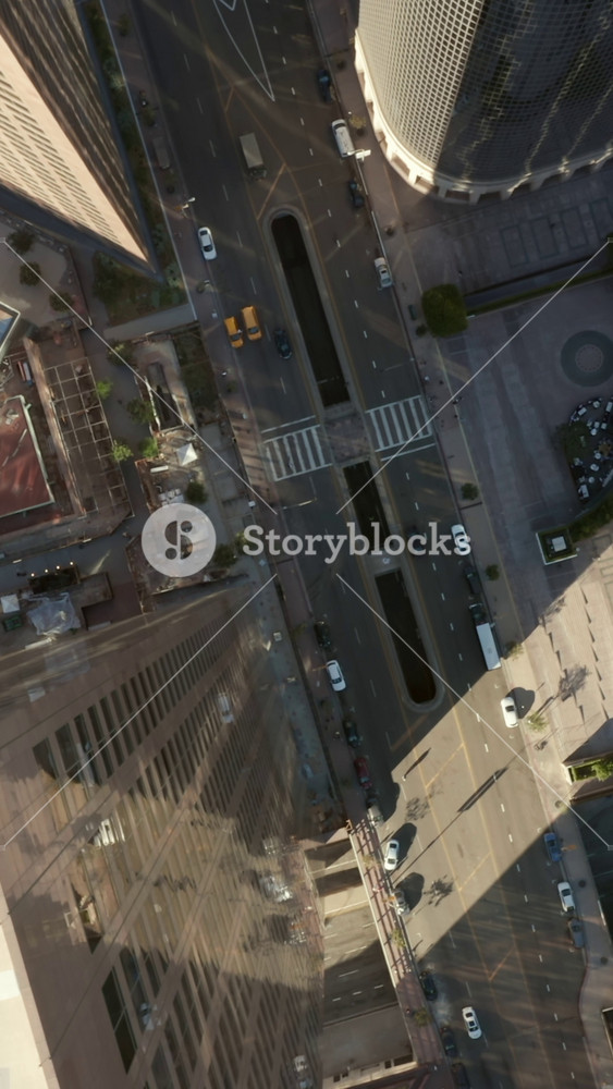 AERIAL: Epic slow lowering and Circling birds eye View over Downtown Los Angeles California in beautiful Sunrise Light with view of