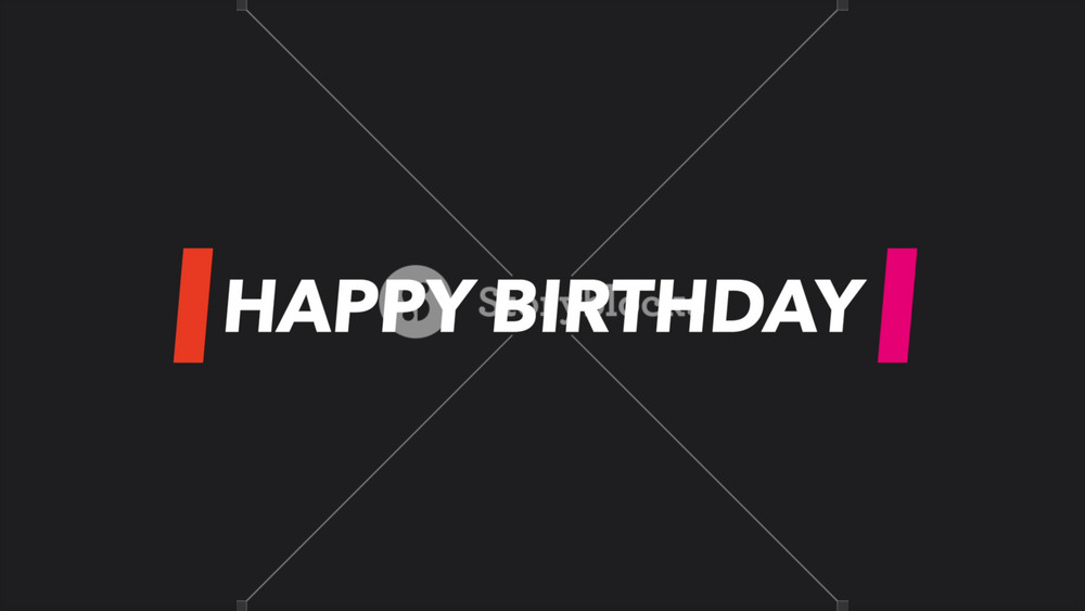 A black and white image of a vibrant birthday cake with Happy Birthday written in red and white, adorned with colorful candles. Celebratory and joyful!