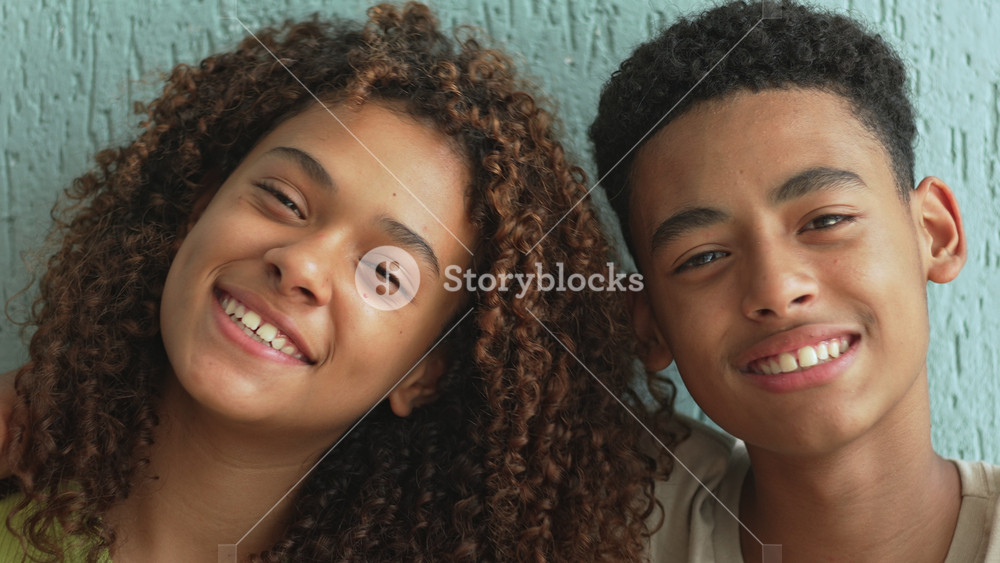 Teenage Girl And Boy Smiling At Each Other Closely With Joyful Expressions, Candid Moment Showing Connection And Warmth Between Friends