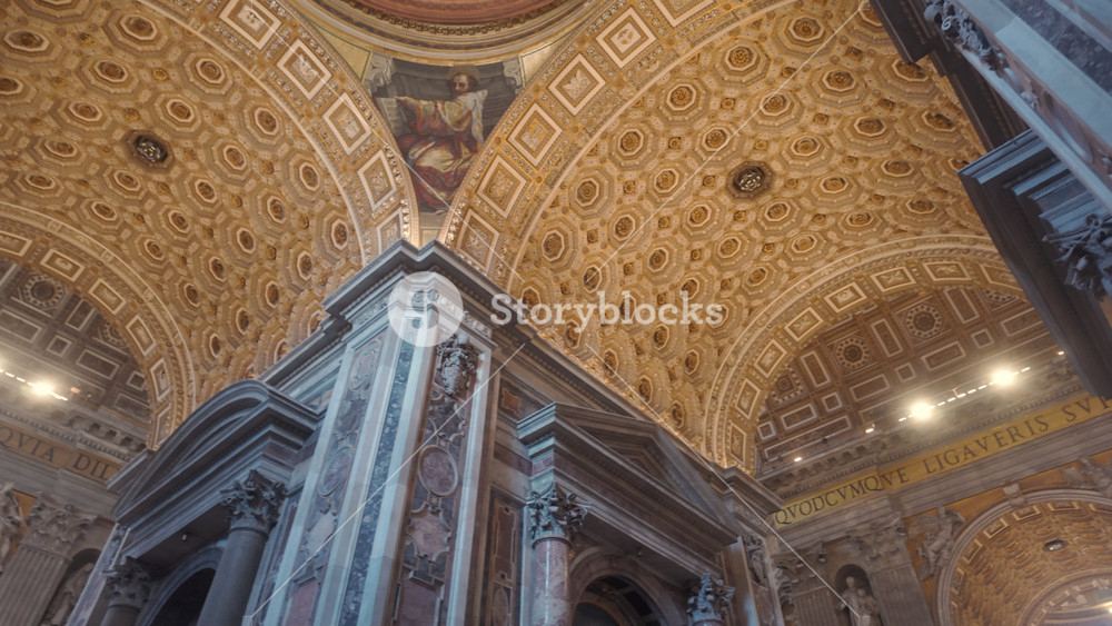 Rome Italy July 30th 2025 Upward View Of Coffered Arch Ceiling With Golden Tones And Frescoes Inside Grand Interior Of St Peters Basilica