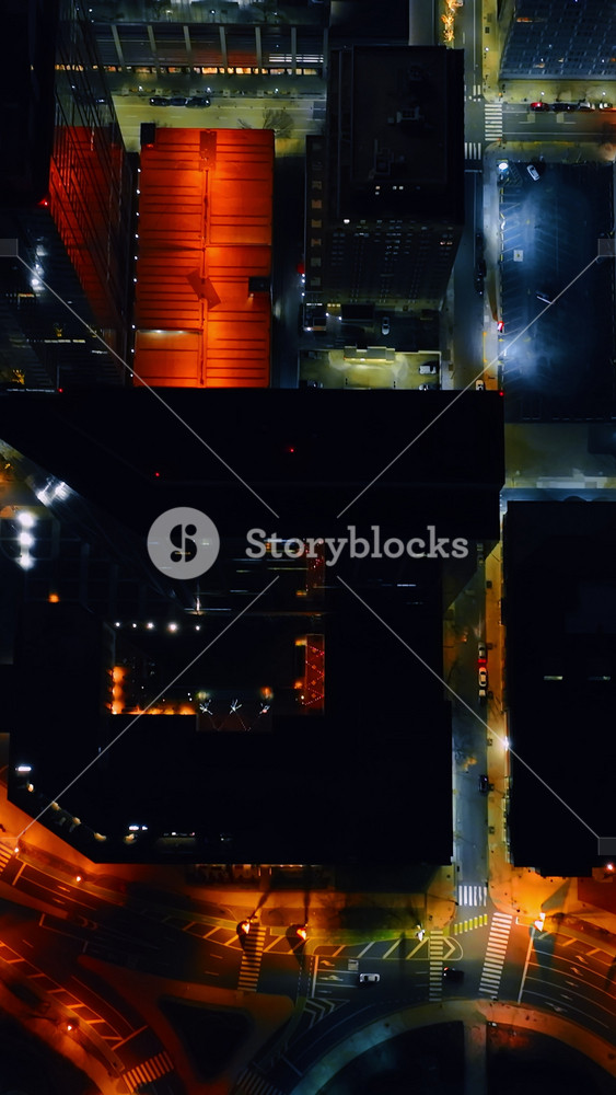 Highlighted streets and buildings in the cityscape of a night city. Top view on Philadelphia, Pennsylvania, USA. Vertical video