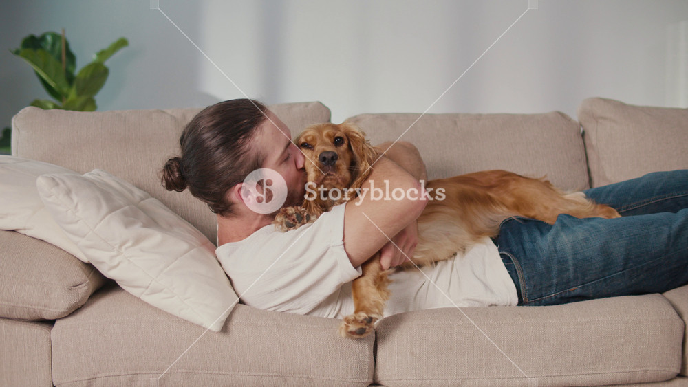 Slow Living, Mental Wellness, Pet Comfort. Man Lies on Sofa Resting With His Dog. Simple, Emotional Moment of Quiet Bonding, Presence, and