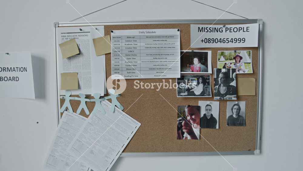 Full zoom-in shot of notice board in emergency accommodation facility for refugees or displaced people, with photos of missing people, daily schedule, fake hotline phone number, newspaper article