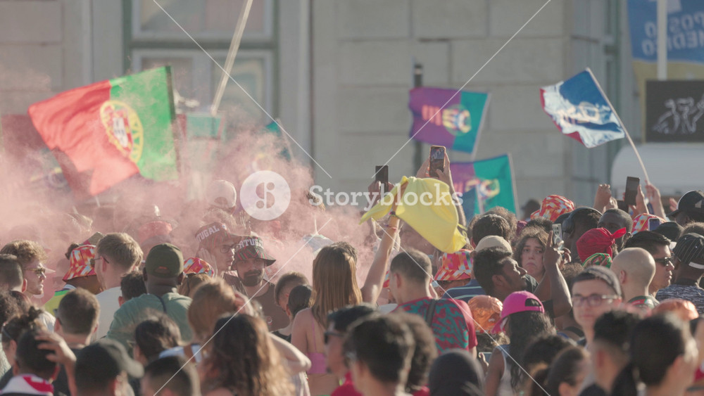 17 june 2026, lisbon, Portugal - Excitement builds among fans during the football championship in Lisbon with colorful smoke and flags