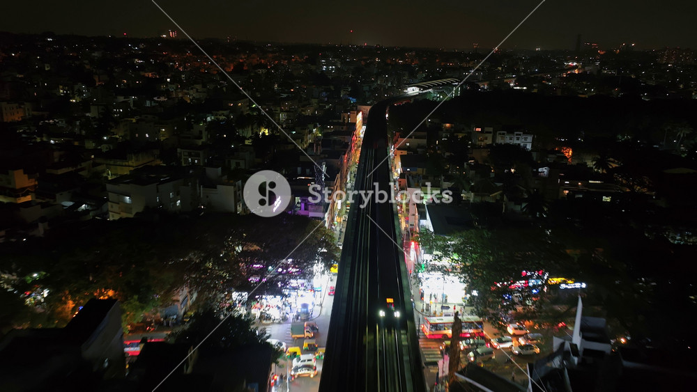 Night top-view aerial view of Bengaluru City in Karnataka. Urban cityscape concept or abstract of advanced innovation, financial technology, and energy power.