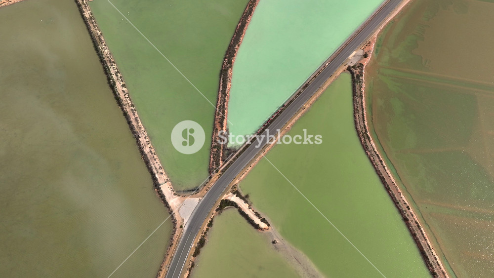 Colorful Saline Salt Marsh in Spain, Aerial view of the San Pedro salt flats and the Mar Menor, Region of Murcia, Spain.