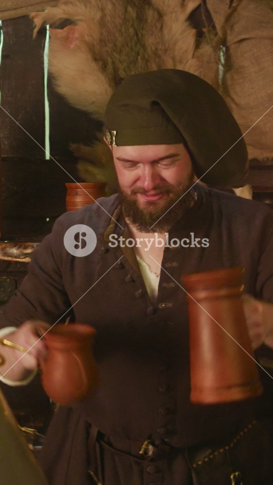 Servant gives drink with straw to knight in tavern. Happy dwarf innkeeper treats alcohol for lord in armour at bar counter. Adventurer