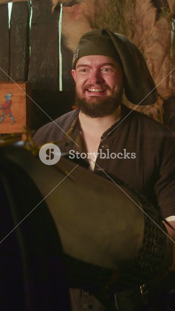 Bartender looks at drinking knight in tavern. Fawning public house owner contaminates reaction of guest on treat in store. Medieval life