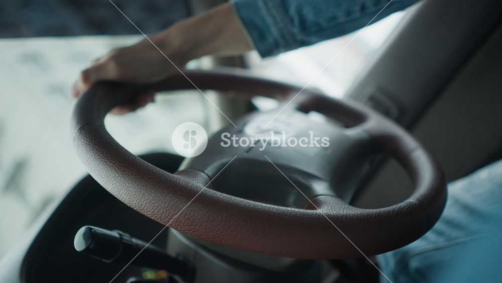 Closeup of vehicle steering details, Intimate shot of car control with textured finish, Focused depiction of male hand gripping steering
