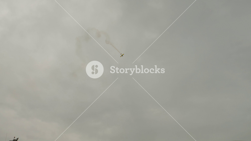 Bucharest, Romania - 31 August 2024: Aeroclub Hawks of Romania plane does acrobatics and goes after airplane Alenia C-27J Spartan at Bucharest International Air Show.