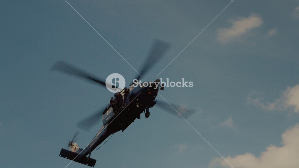 Iasi, Romania - 16 May 2026: A combat helicopter performs maneuvers during an air show. The aircraft showcases its flying skills to the audience at the airport, drawing attention from spectators.