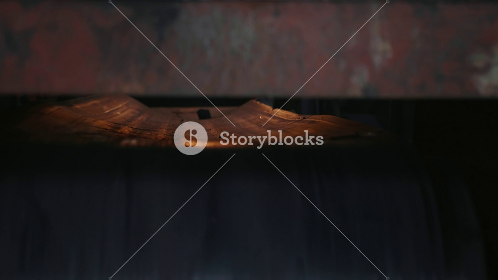 Conveyor belt line close up at the factory with sand and metal balls. Metal production factory. Metallurgy or heavy industry process.