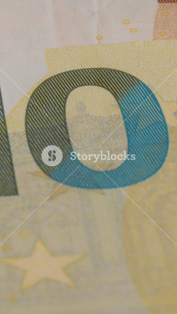 Vertical Screen: Close-up view of a euro banknote highlighting its unique design, including regions and symbols that represent the European Union and its diverse culture.
