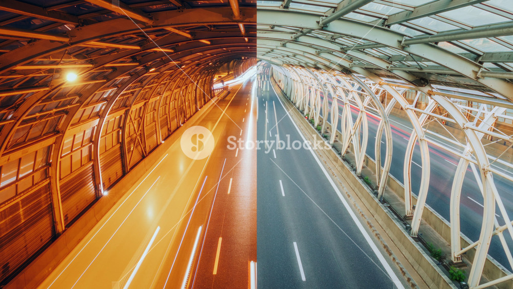 Day and night half split framed time-lapse shot traffic light trails city highway. Long exposure futuristic speedway steel pipe road tunnel in Warsaw. Lot of cars driving fast busy modern roadway