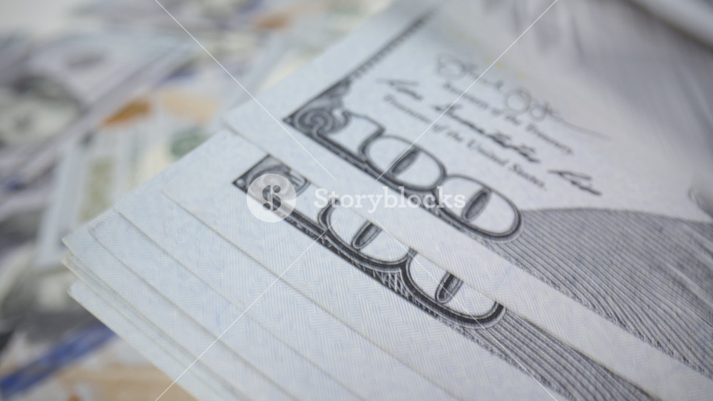 Macro close-up of counting hundred dollar bills, count paper money, US dollars cash, salary, finance and investment, world economic crisis