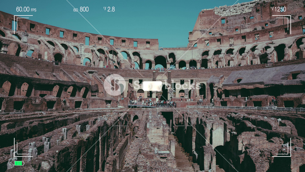 Rome, Italy - June 1, 2022: A look through the photo camera at interior of Colosseum in Rome. Summer day with blue and sunny sky
