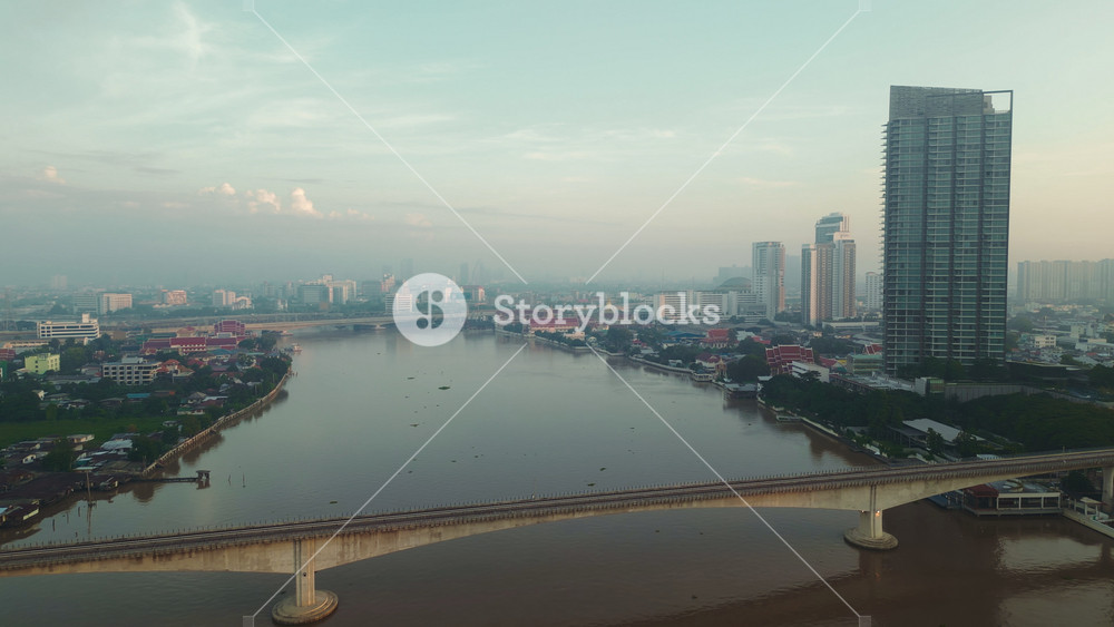 Aerial view of a vibrant Bangkok cityscape a bustling city along the river with a mix of modern architecture and natural serenity.
