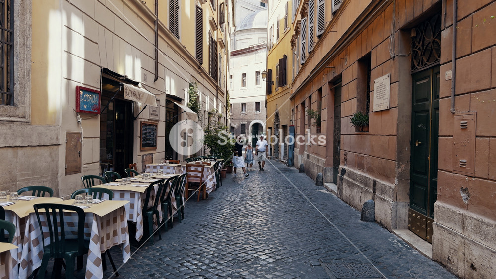 Rome, Italy - August 21 2024: POV view beautiful streets of Rome with tourists in the summer on a sunny day. Old architectural buildings